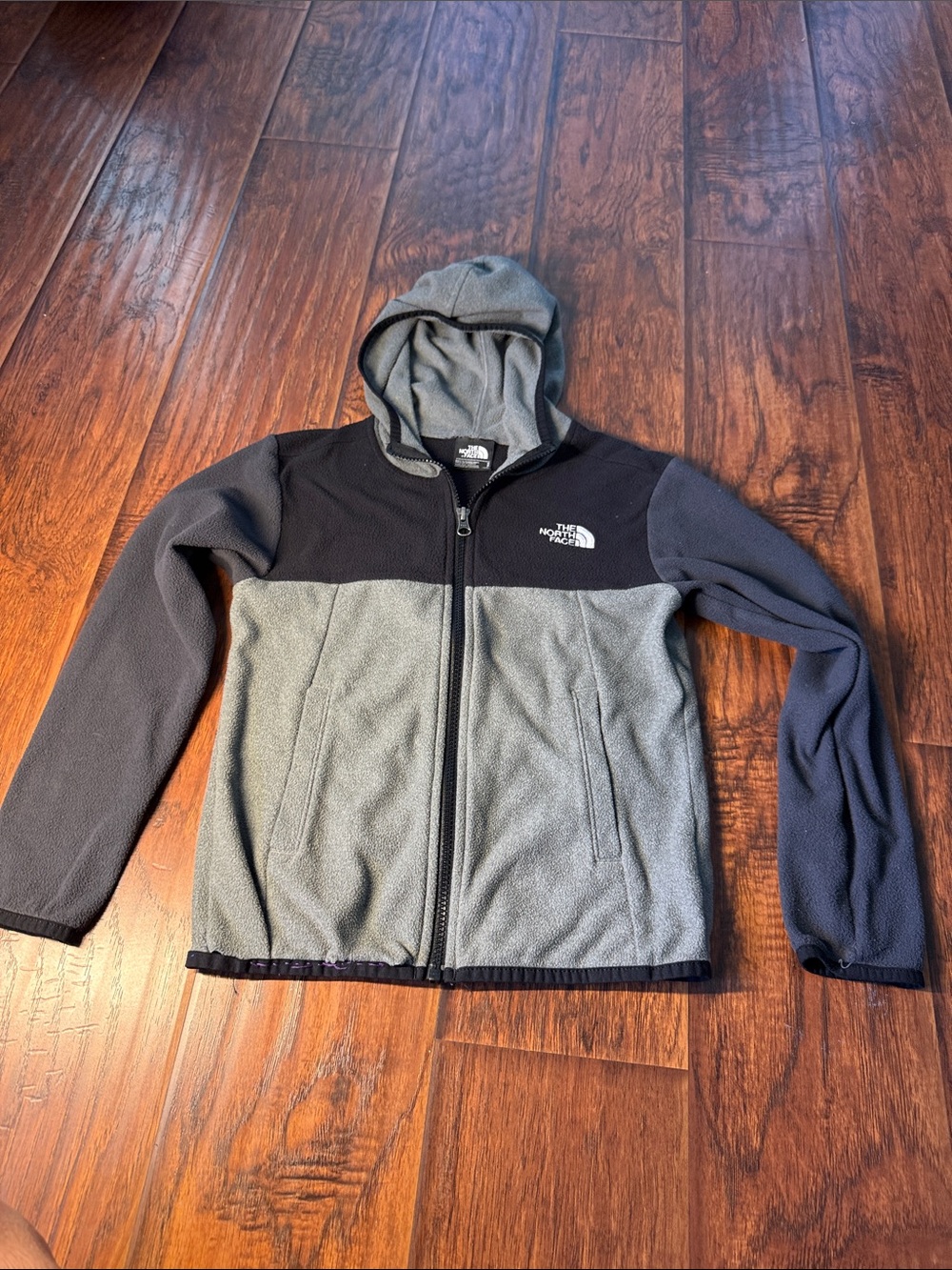 The North Face Kids Gray and Black Hooded Fleece Jacket. Boys 7/8. Good conditio